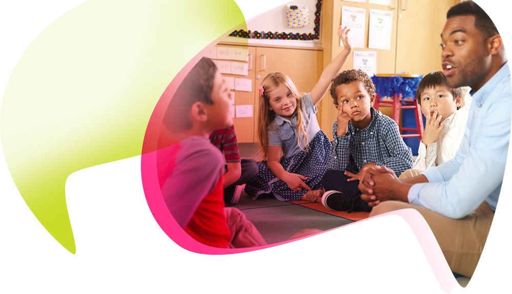 Children sitting on floor with teacher in a classroom setting